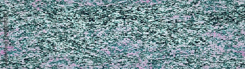 Abstract teal and green speckled textured background with granular noise pattern.