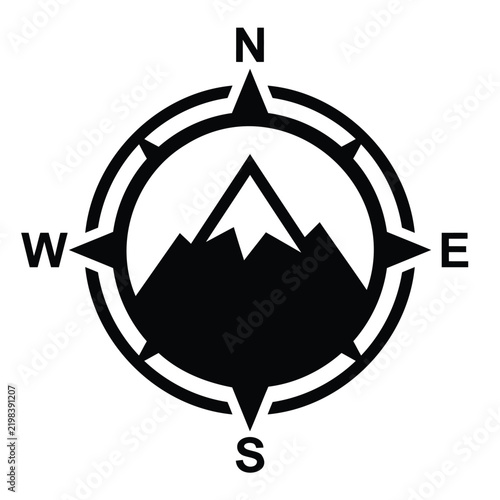 Black and white compass icon with mountain peak silhouette for adventure travel or hiking navigation design elements