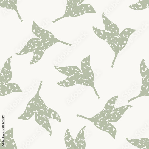 Simple sage green and cream white block print leaves seamless vector pattern background. Vintage style backdrop tossed all over layout. Botanical backdrop warm biophilic colors. Textured look.