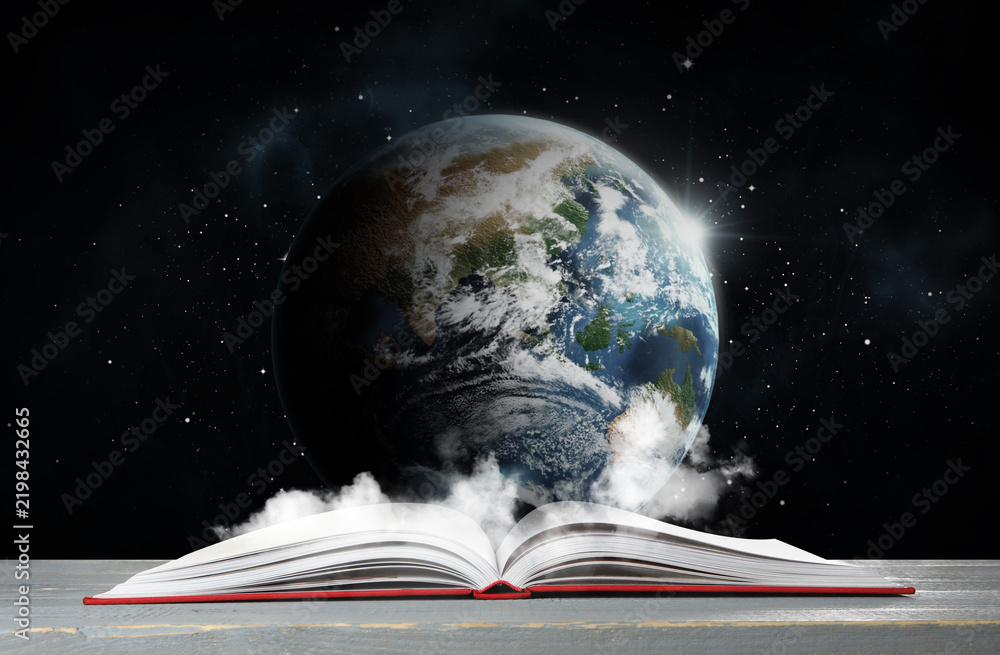 Fototapeta premium Open book on table against planet in space