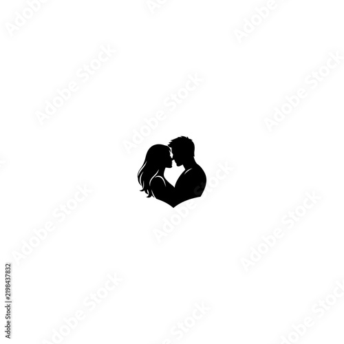 Silhouette of a Passionate Couple Embracing and Kissing.
