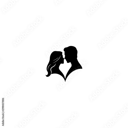 Silhouette of a Passionate Couple Embracing and Kissing.