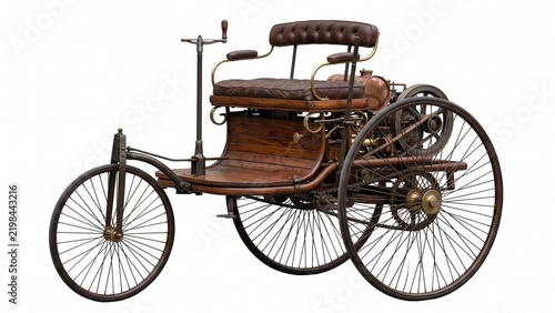 Antique wooden motorized carriage featuring large metal wheels and vintage brown leather seating on white background