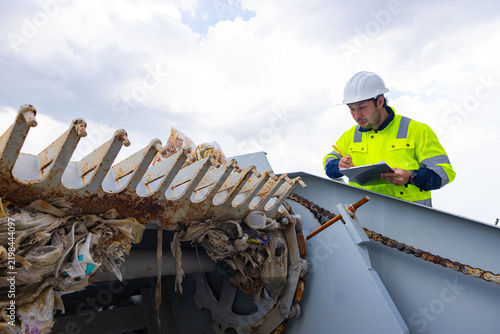 Engineer Inspecting Wastewater Screening Equipment