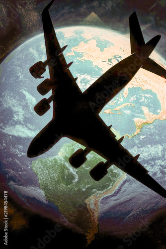 Aerial view of a plane soaring through the clouds, with the curvature of the Earth visible in the distance vertical frame