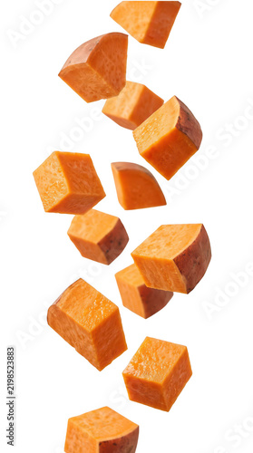 Levitating chunks of fresh sweet potato isolated on a transparent background, creating dynamic motion with vibrant orange yams floating midair for culinary and healthy cooking concepts.