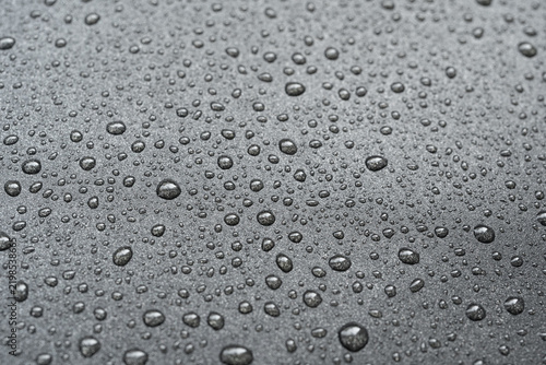Oil drops on frying pan texture, water splash pattern on black non-stick coating