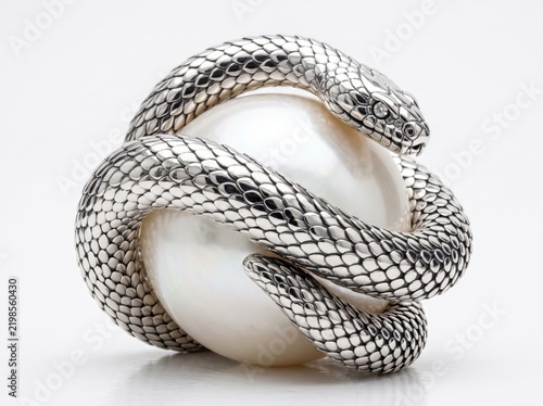 Silver snake coiled around luminous white pearl