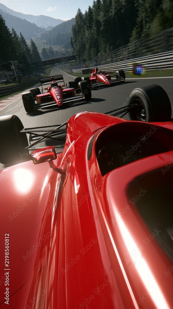 Obraz premium Red Formula One Cars Racing on a Mountain Track