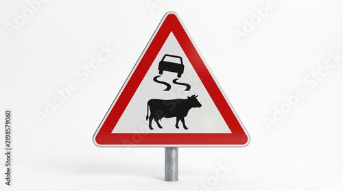 Cautionary Road Sign Warns Of Slippery Conditions And Livestock Presence