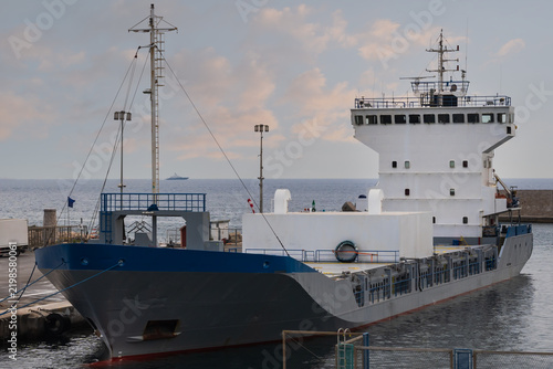 Konstfotografi Industrial cement carrier cargo ship moored at the dock in Port of Nice, French Riviera, preparing for bulk material maritime transportation