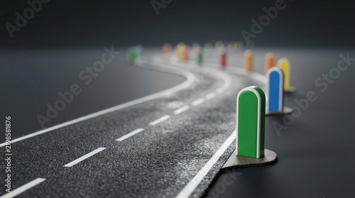 Colorful Milestone Markers on Winding Asphalt Road