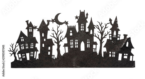 Black paper cutout silhouette of a spooky haunted house village for Halloween decoration design