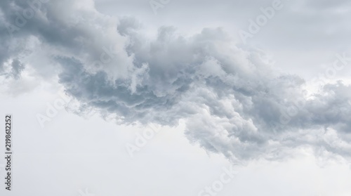 Grey textured rain clouds filling the stormy sky with overcast weather pattern storm front gloomy sky nature background
