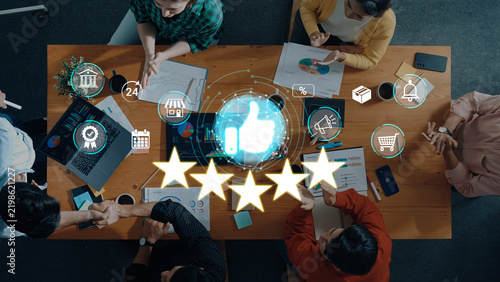 Group of diverse people collaborating around a table while analyzing data and discussing project outcomes for business success and customer satisfaction concepts. Sentient.