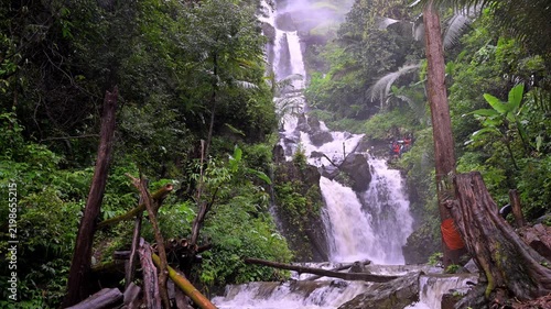 Huai Nam Yen Waterfall cascading through lush tropical rainforest in the rainy season in Omkoi District Chiang Mai, Thailand