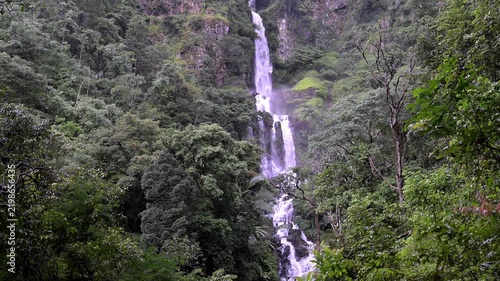 Huai Nam Yen Waterfall cascading through lush tropical rainforest in the rainy season in Omkoi District Chiang Mai, Thailand