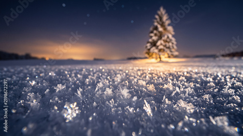 Snowflake close up on snowy field at night
