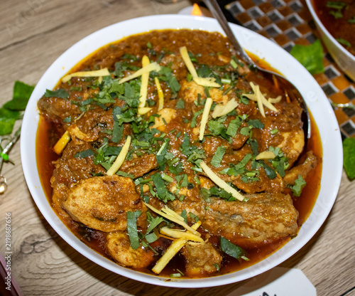 Traditional South Asian Cuisine and Spicy Curry Dish Served in a Restaurant Setting