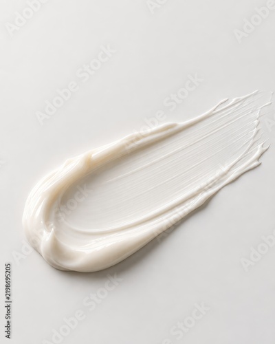 White Skincare Cream Smear Texture on Neutral Background With Copy Space