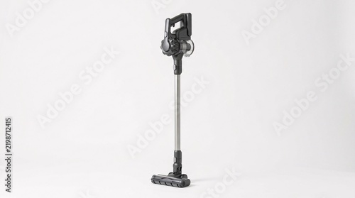 A sleek modern cordless stick vacuum cleaner standing upright by itself against a plain white background.