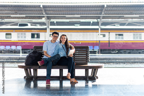 Couple waiting at train station