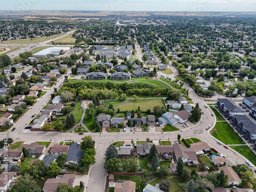 Saskatoon neighborhood aerial photo showing suburban homes, green parks