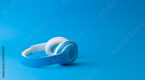 Blue Wireless Headphones on Matching Blue Background Monochromatic Shot