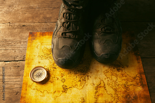 Hiking boots on a map. Travel concept.