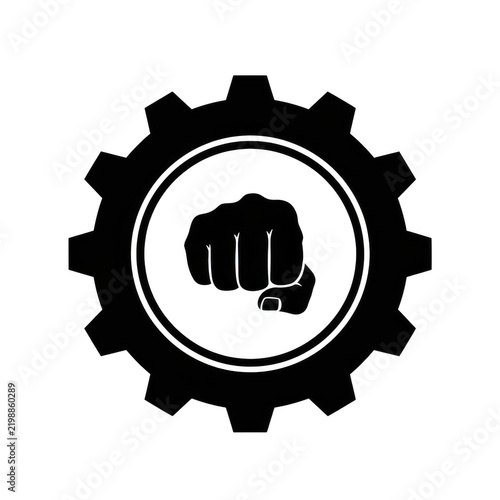 black fist icon inside gear cog symbol representing power and industry with strong effort and determination.
