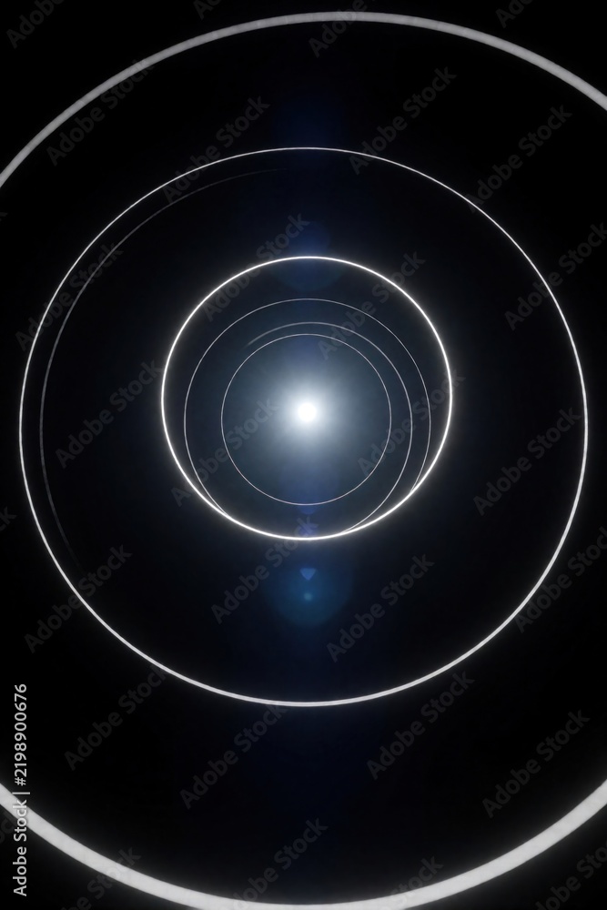 Fototapeta premium Concentric circles of white light glow against black. A bright light source at the end of tunnel creates bright flare and blue lens effect, suggesting portal or digital space.