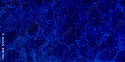 Deep blue marble texture with intricate veining and subtle lighter blue accents, abstract background