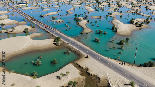 Canvastavla Aerial view of road crossing turquoise water and sand dunes in Hotan, Xinjiang