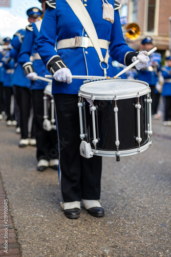 Snare Drummer in Traditional Blue Marching Band Uniform at Street Festiva
