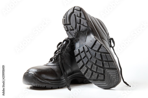 Canvastavla Pair of black leather safety boots displayed on white background, highlighting d