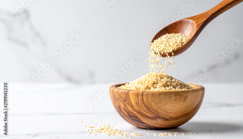 Organic White Sesame Seeds Pouring Wooden Spoon Top View Minimal Food