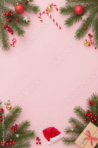 Decorative Christmas Arrangement on Pink Background With Various Ornaments an...