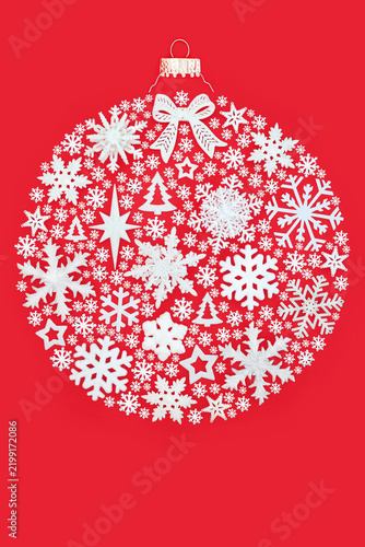 Christmas round shape white bauble tree decorations on red background. Fun surreal design concept for festive Xmas season greeting card.