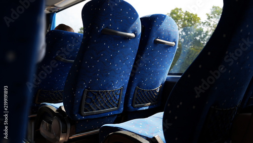 Interior of tourist bus with blue seats