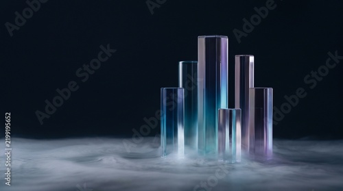 Abstract glass pillars with mist on dark background