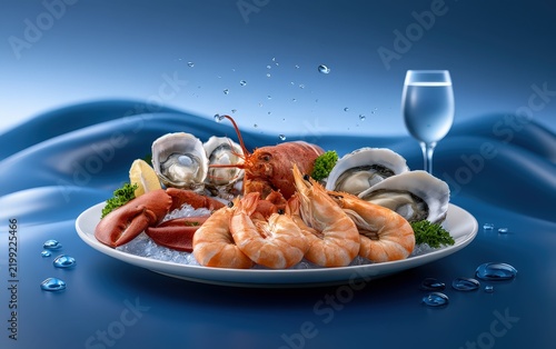 Delicious Seafood Platter with Shrimp Crab and Oysters on a Blue Table with Water Drops