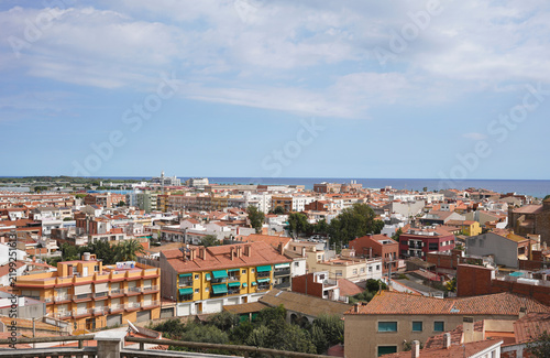 view from above on small Spanish city Malgrat de mar with narrow streets and sea in a background, daytime