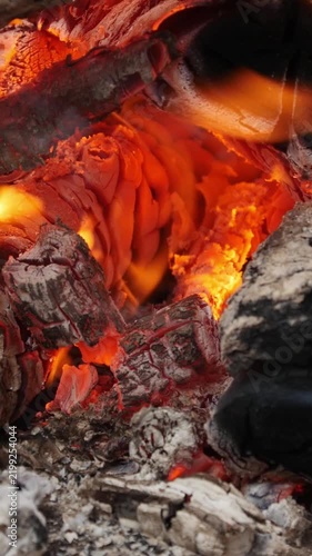 Handheld Shot of Burning Firewood and Glowing Embers