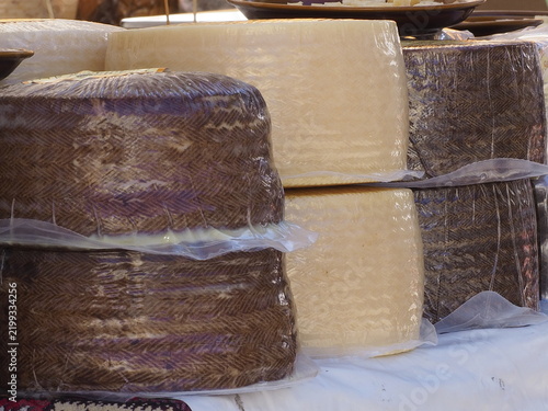 Obraz na płótnie Manchego cheese wheels wrapped for market selling