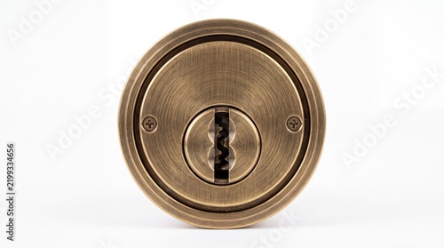 Antique brass round door lock cylinder with intricate metal texture isolated on white background