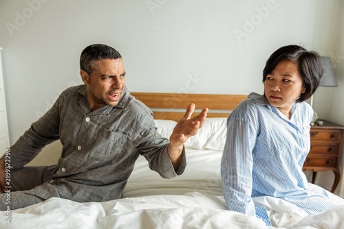 Obraz na płótnie Couple arguing in bedroom setting.