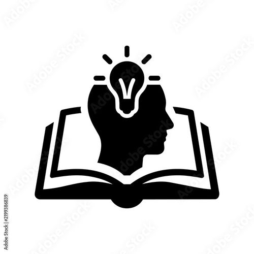 Black icon of human head and lightbulb emerging from book representing intelligence and intellect