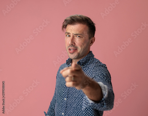 Принти на полотні Suspicious man pointing finger forward and questioning