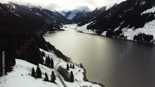 Cinematic Aerial Drone View Over Achensee Alpine Lake in Snow-Covered Austrian Alps in Winter