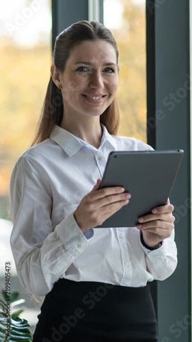 Businesswoman Using Tablet in Modern Office